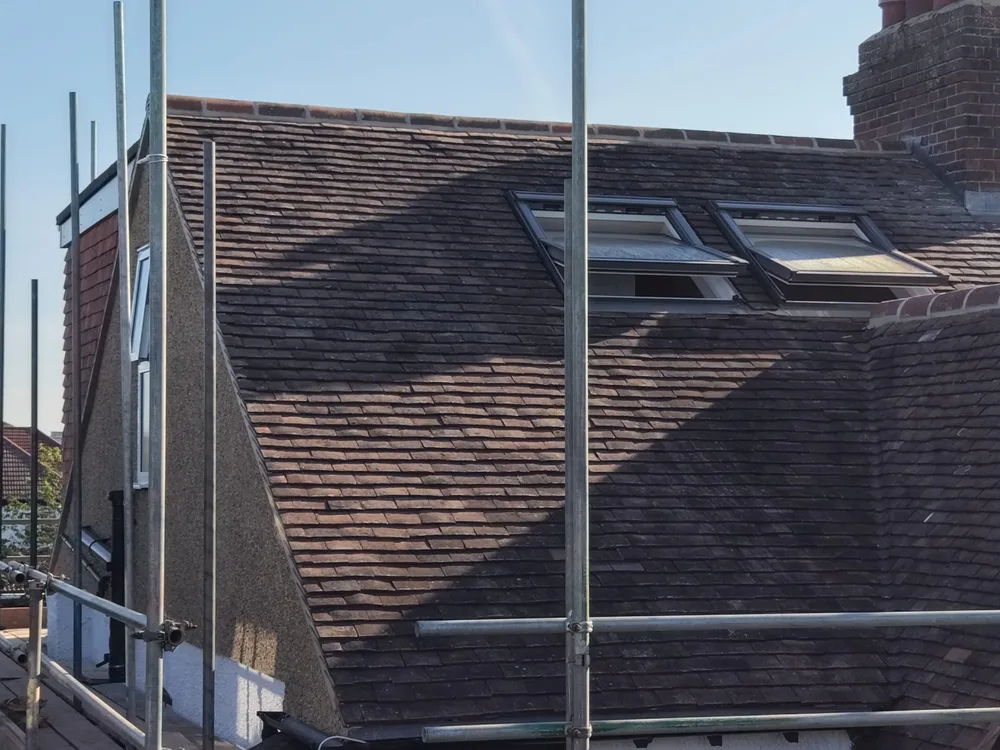Tiled roof of a Beckenham hip to gable loft conversion with two roof windows set into the slope