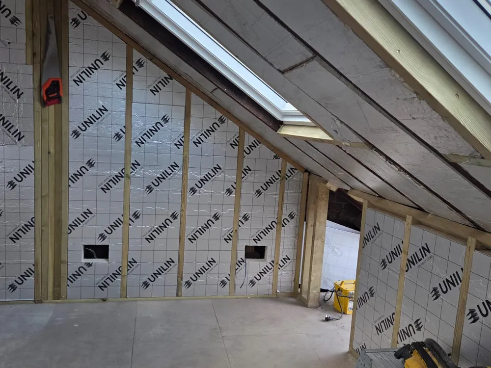 Beckenham loft conversion mid-build, the roof insulated to modern standards with a new skylight