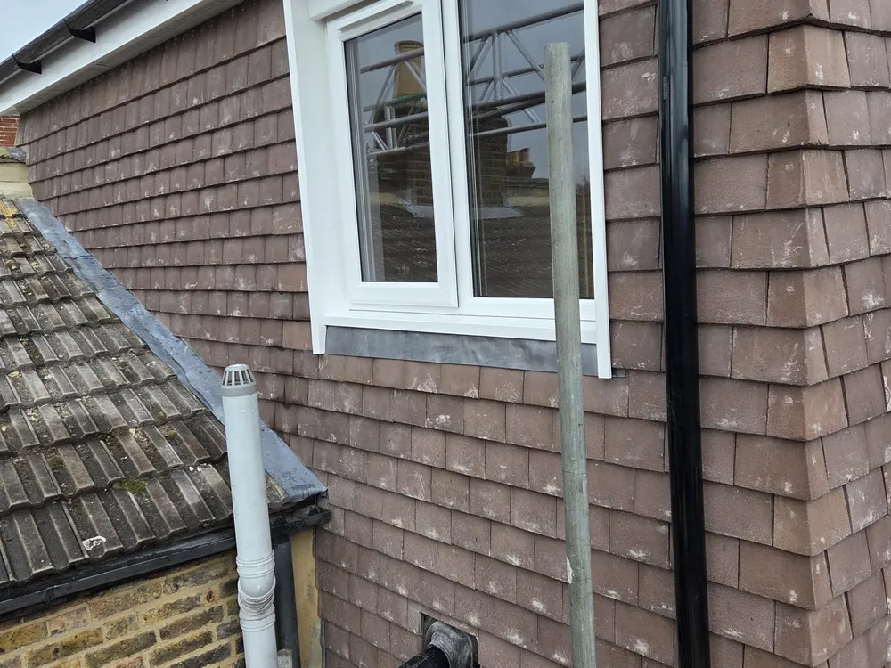 New tile-hung gable and window on a hip to gable loft conversion in Beckenham