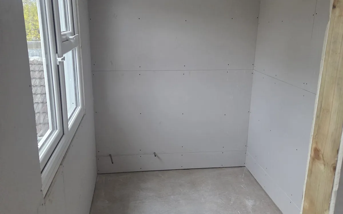 The walk-in wardrobe taking shape in a Beckenham rear dormer loft conversion
