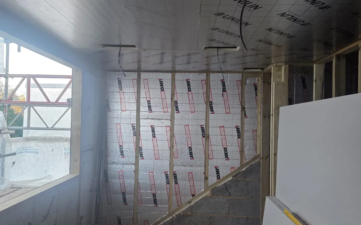 Box dormer window and flat insulated ceiling in a Penge loft conversion, giving full head height