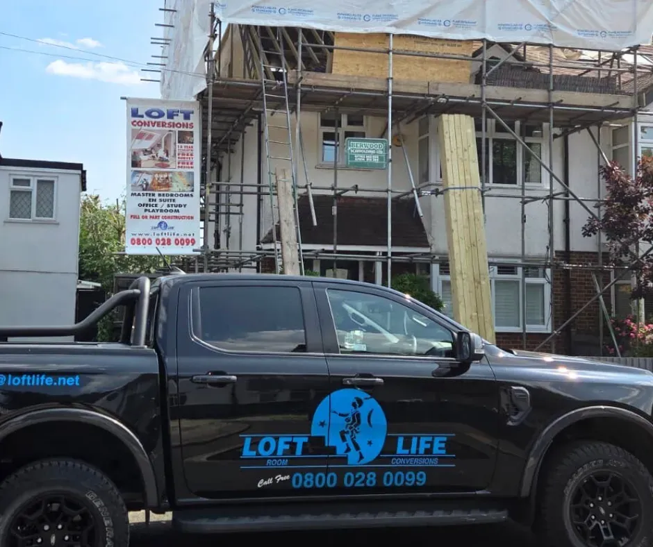 The Loft Life van outside a house with scaffolding up at survey stage